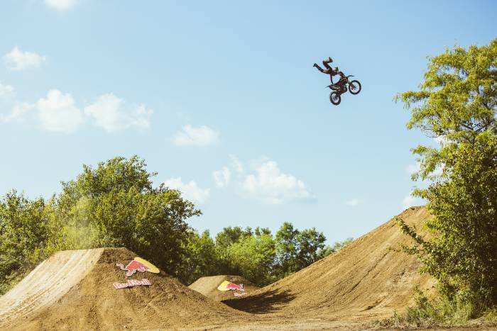 Vicki Golden mid-air off a jump while riding motocross at RED BULL IMAGINATION