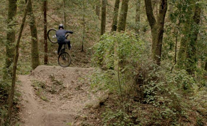 Isaac Wallen mountain biking on dirt trail