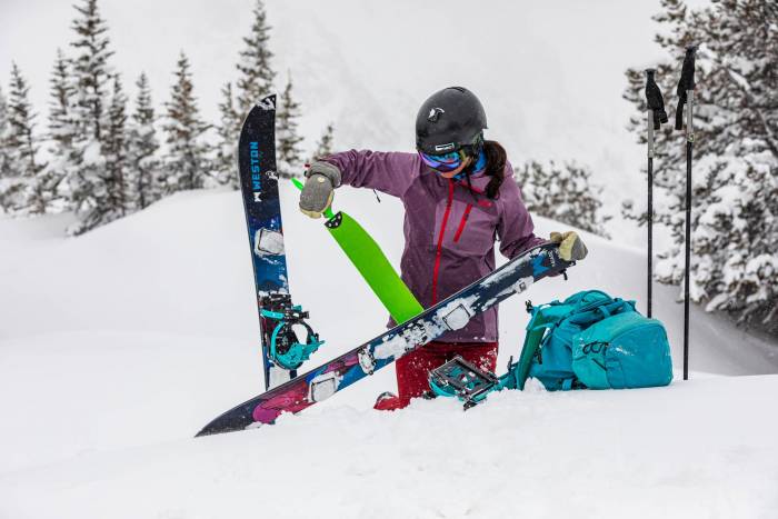 female snowboarder with an artist collaboration designed Weston Eclipse Splitboard