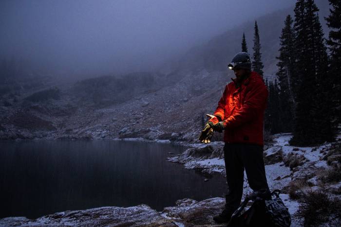 Person standing on a snowy shore wearing Beyond Clothing Gear