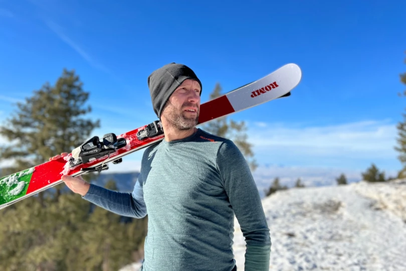 gear tester and author Steve Graepel wearing the Ortovox Rockn Wool base layer long sleeve as he carries skis