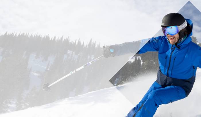 skier in a gore-tex blue rental jacket and blue rental pant