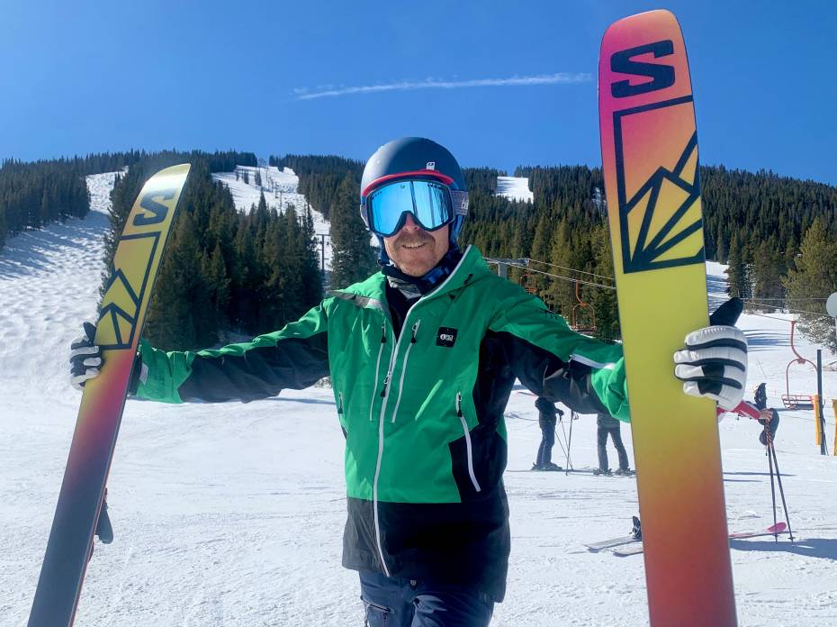 Soft Snow Sender: 2023 Salomon QST 106 Ski Review Skier holding Salomon QST 106 skis