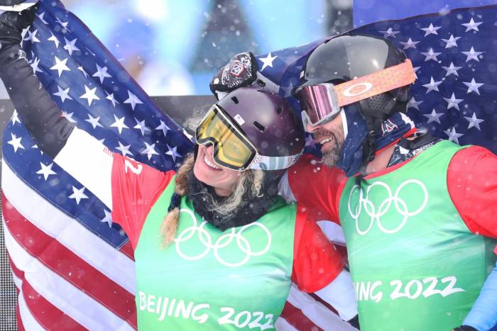 Lindsey Jacobellis (36) and Nick Baumgartner (40) of Team USA celebrate after taking gold in the mixed snowboard cross event (Photo Ian MacNico Getty) adventure news of the week