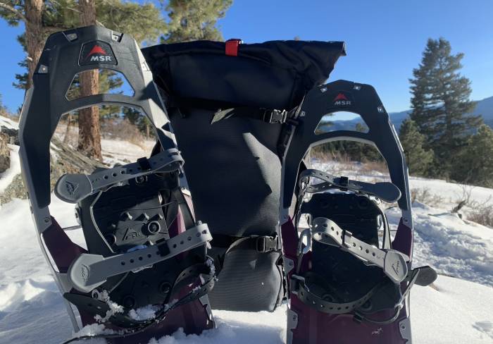 msr snowshoe pack along with a pair of purple MSR snowshoes