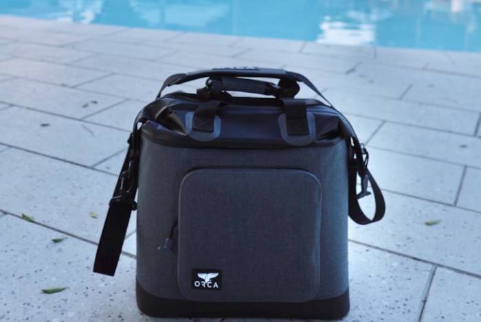 orca walker cooler tote sitting poolside