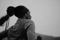 black and white photo of tracksmith athlete rolanda bell running