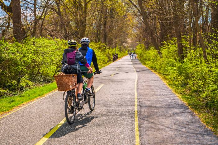 couple cycling on bike path