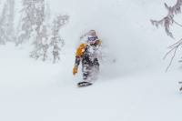 Watch World's Best Snowboarders Now in Second Jewel of Natural Selection 'Triple Crown' Travis Rice exiting the white room at Baldface Lodge. credit: Dustin Lalik