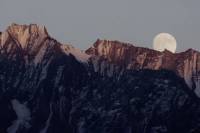 After 2 Years, 5Point Adventure Film Festival Returns in Person With 4 World-Premiere Films a full moon dropping low in the sky behind a reddish mountain range