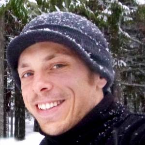 contributing writer Alex Sigalis in a hat dusted with snowflakes