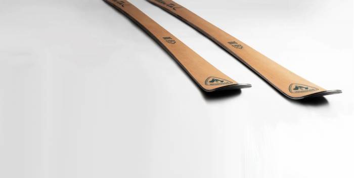 rossignol essential ski against gray gradient background