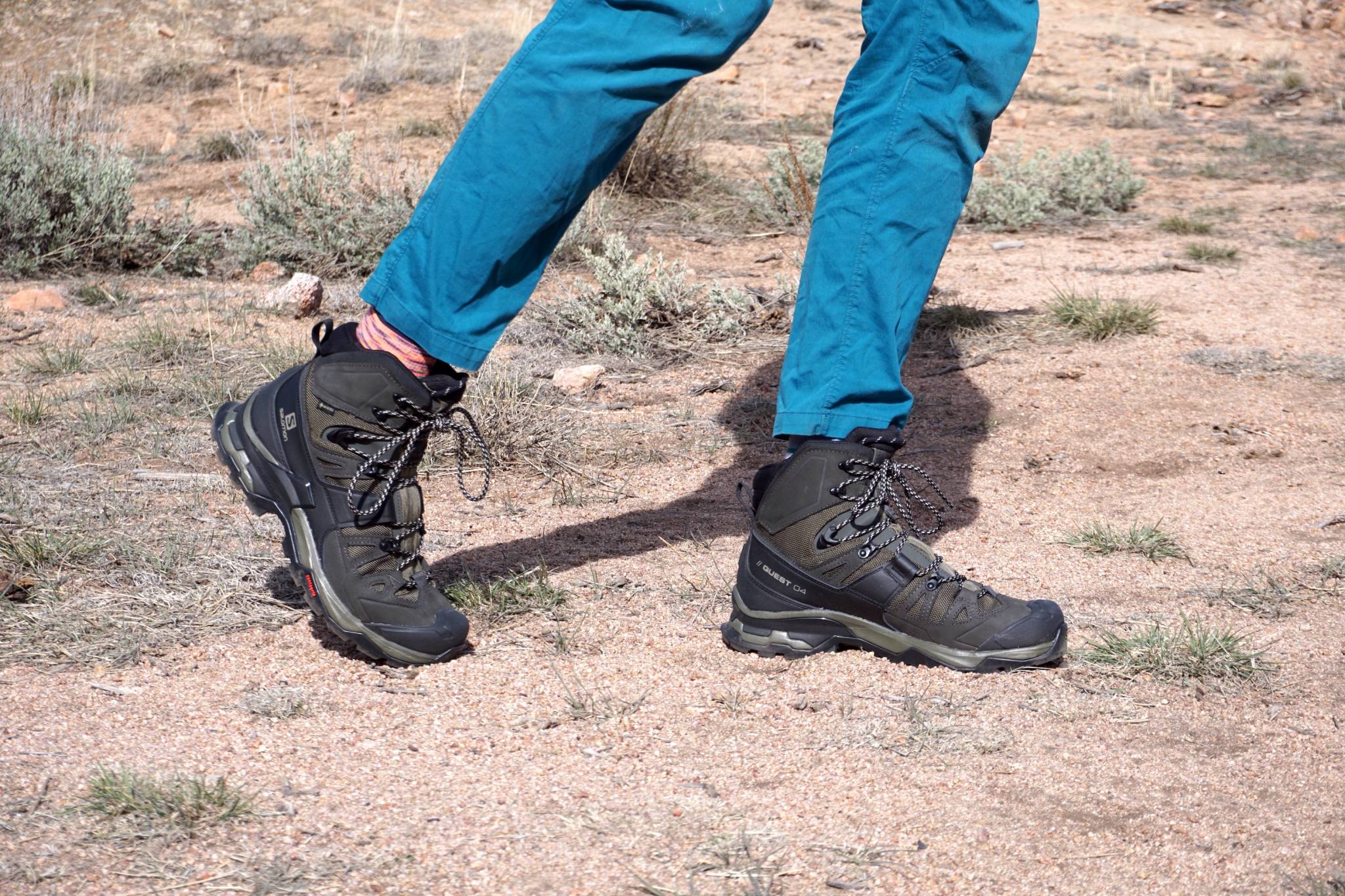 Staff writer Austin in bright blue arc'teryx pants hiking in the Salomon quest 04 mid hiking boot