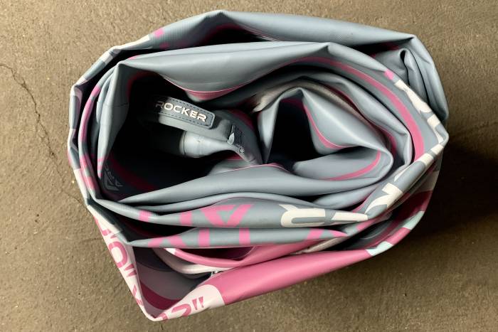 iROCKER paddleboard rolled up for storage