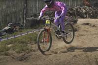How Does Top MTB Tech Perform on Actual Downhills? Watch Here a mountain bike rider rides downhill at the Andorra World Cup Downhill