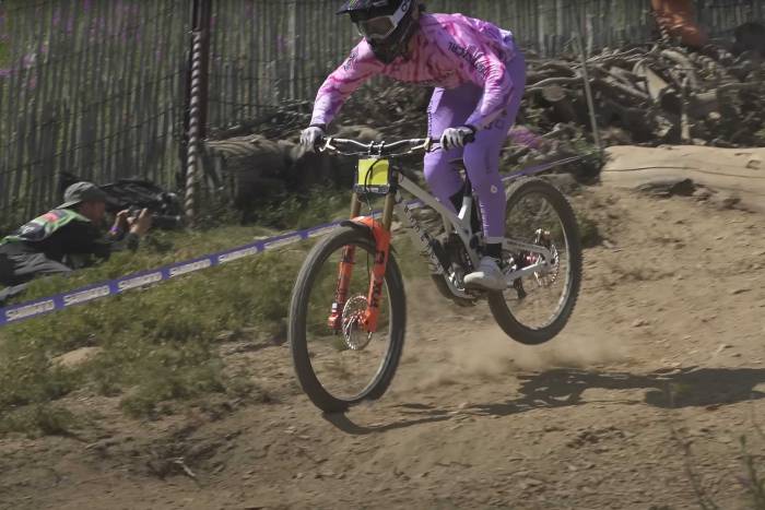 a mountain bike rider rides downhill at the Andorra World Cup Downhill
