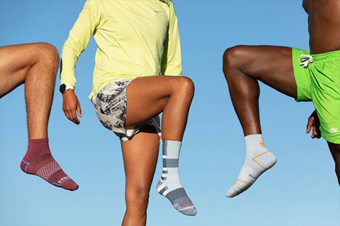 three runners heading on a run wearing Bombas socks