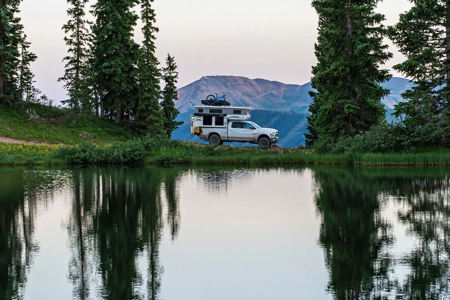 Hallmark Ute truck camper parked lakeside