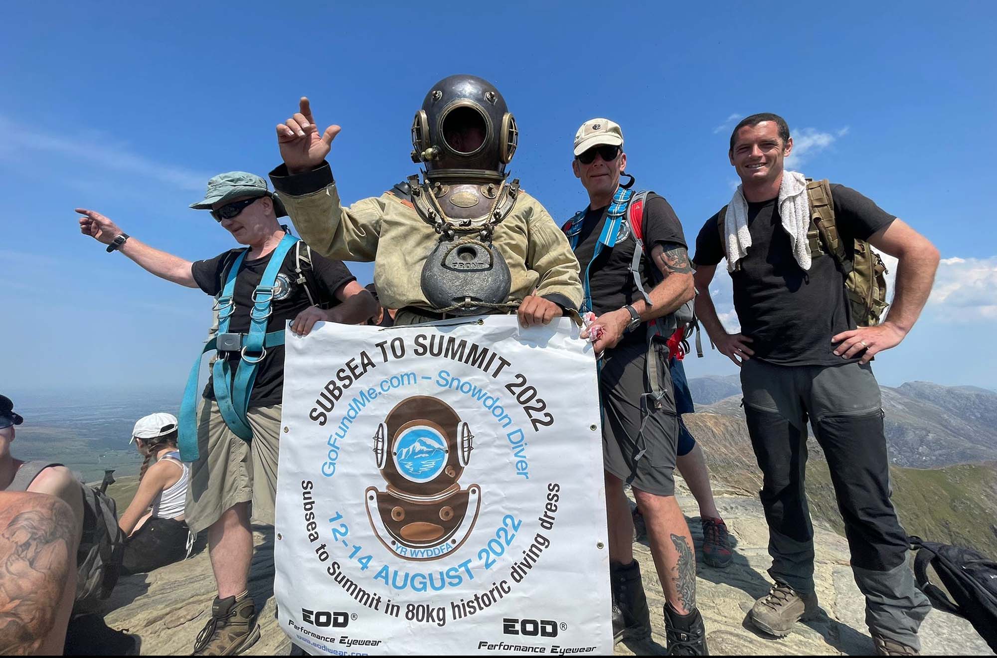 'Diver Man' Climbs Mountain in 180Lb. Vintage Diving Suit, Raises