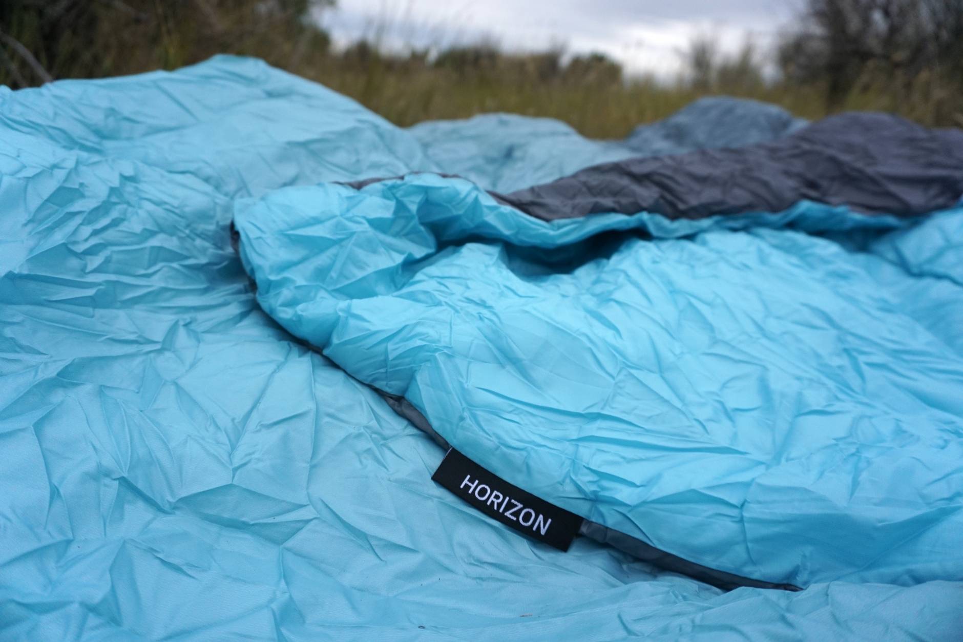 thumbnail image 2 of Klymit Horizon Packable Camping Blanket | PrimaLoft Insulation, Water-Resistant | 58" X 80" | Blue/Black 2 of 13