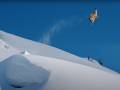 Sick Jumps, Clean Lines in Trailer for New Snowboard Film a snowboarder catches huge air against a blue sky in a screenshot from the ARK trailer