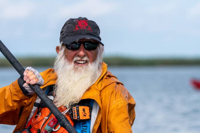 Dale Sanders paddles his canoe on the Mississippi River