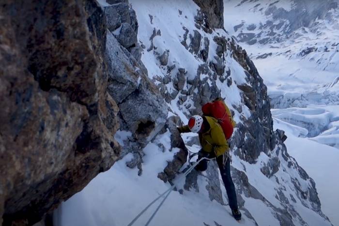 a climber on a peak in Nepal in the film The Phantom Line
