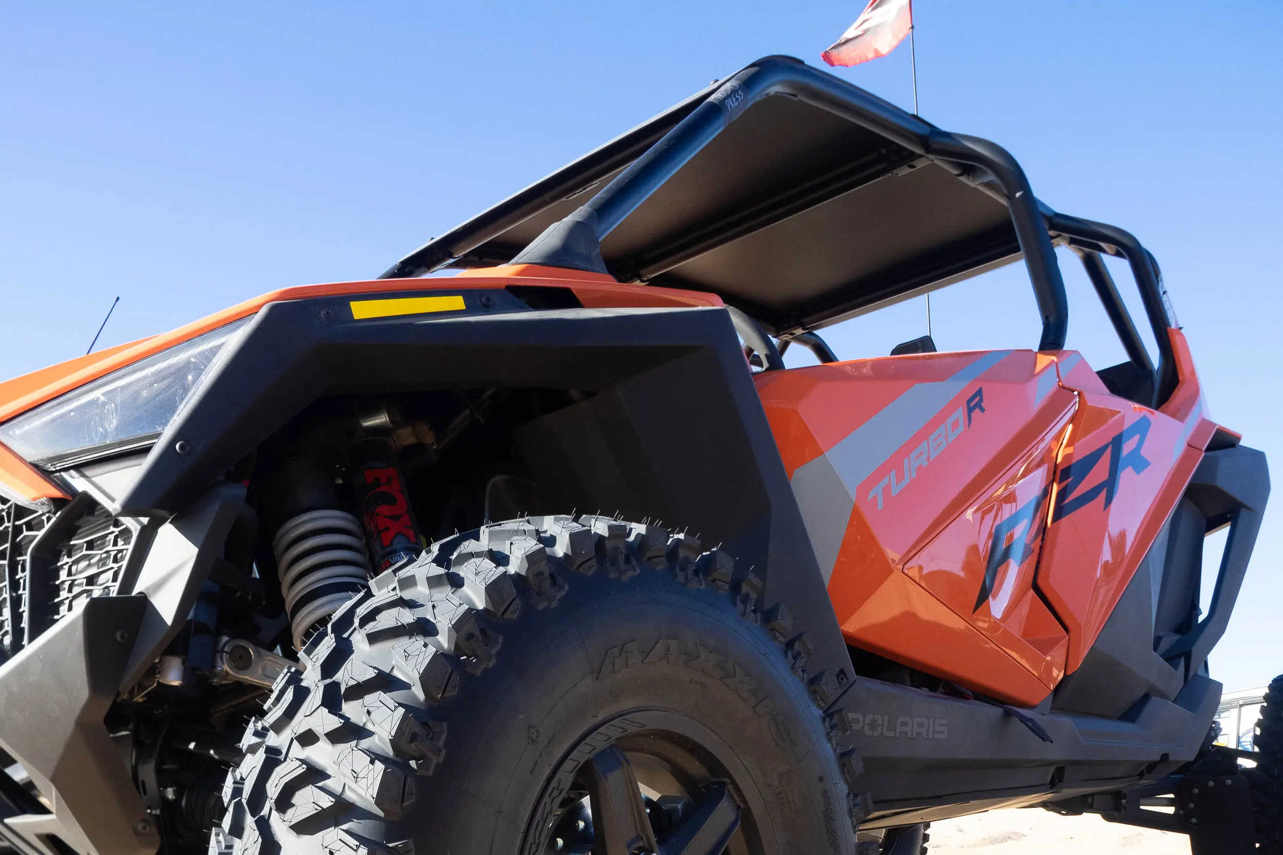 2023 Polaris RZR Turbo R 2023 Polaris RZR Turbo R driving on a sand dune