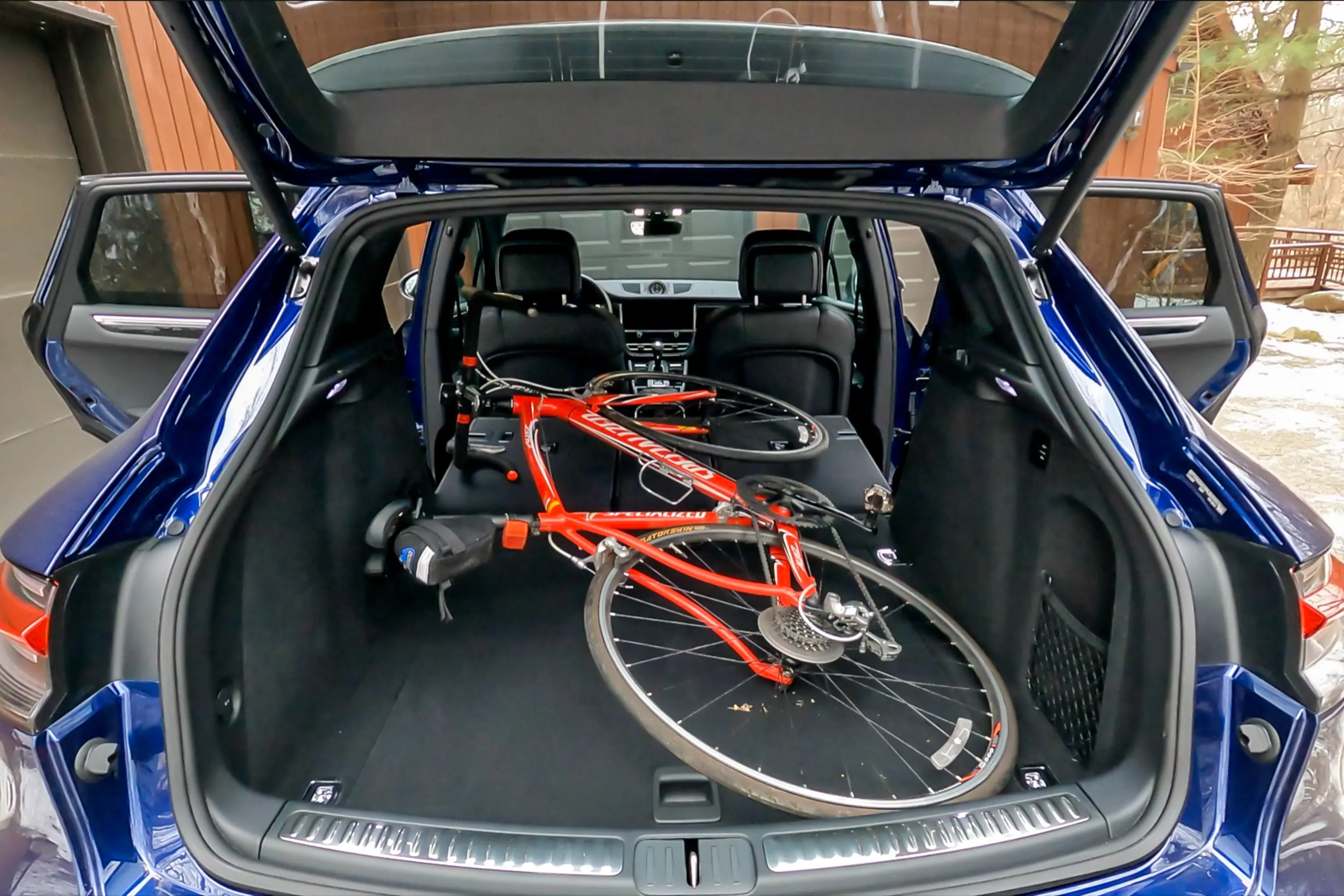 2023 Porsche Macan T interior seats folded down with bicycle inside