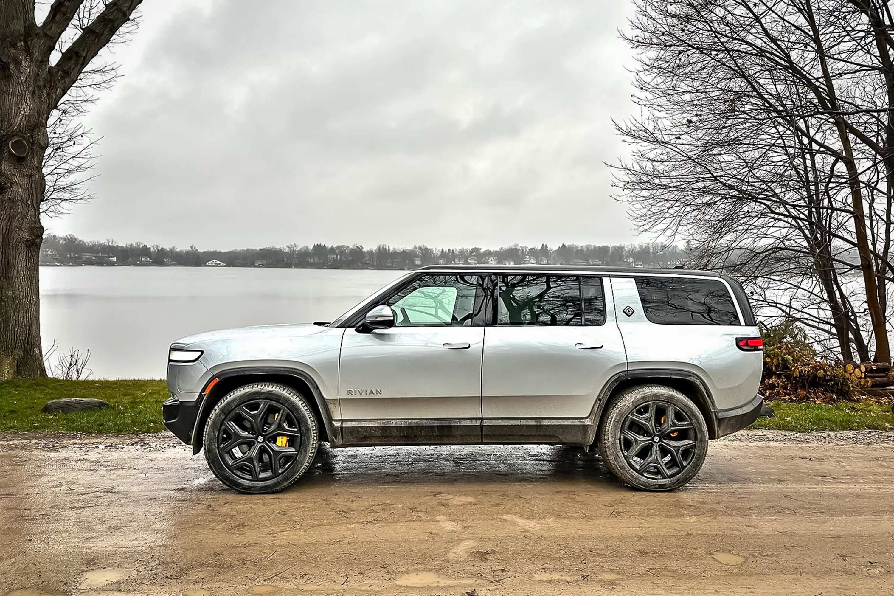2023 Rivian R1S EV SUV review profile on muddy road