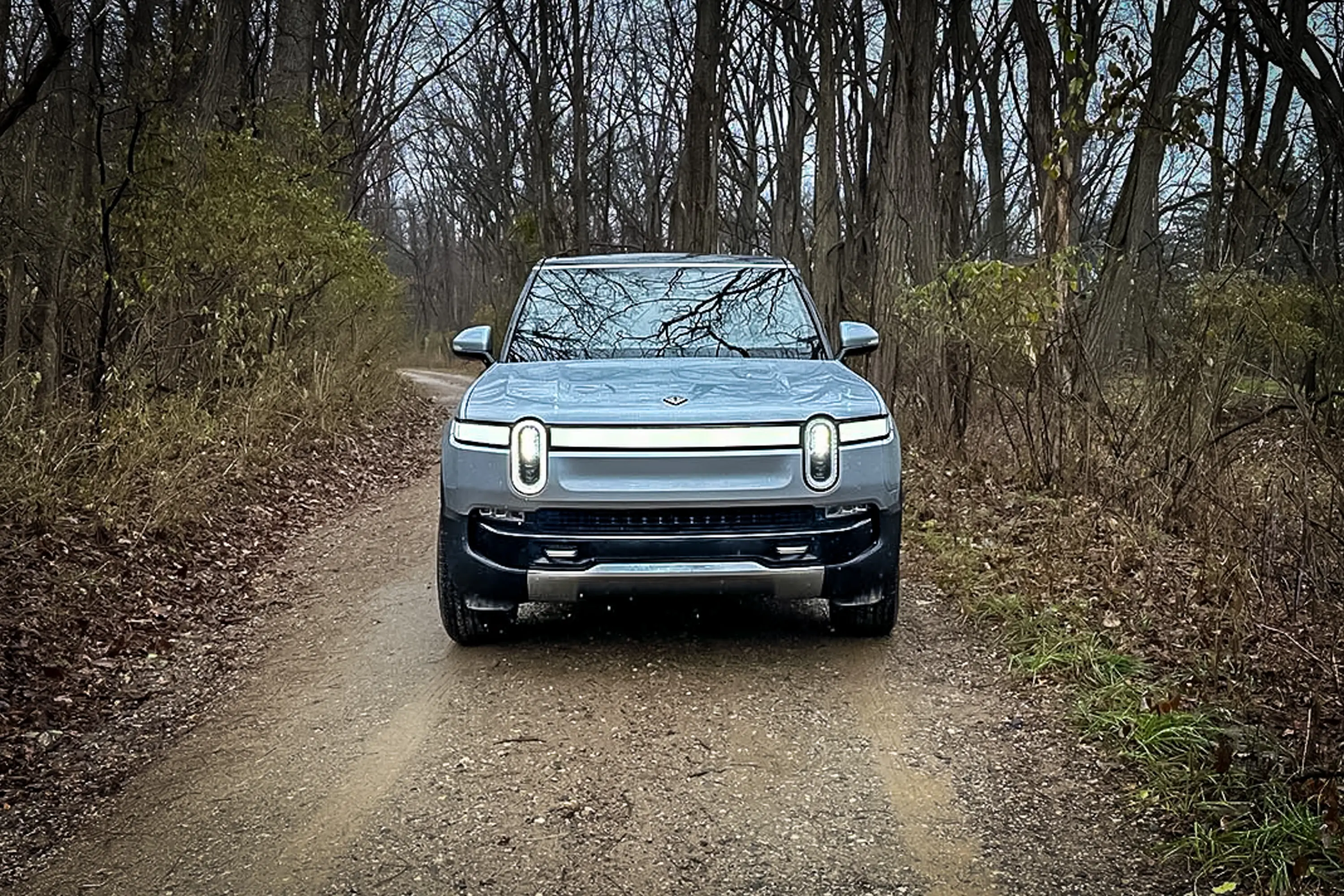 2023 Rivian R1S EV SUV review front view, on muddy trail