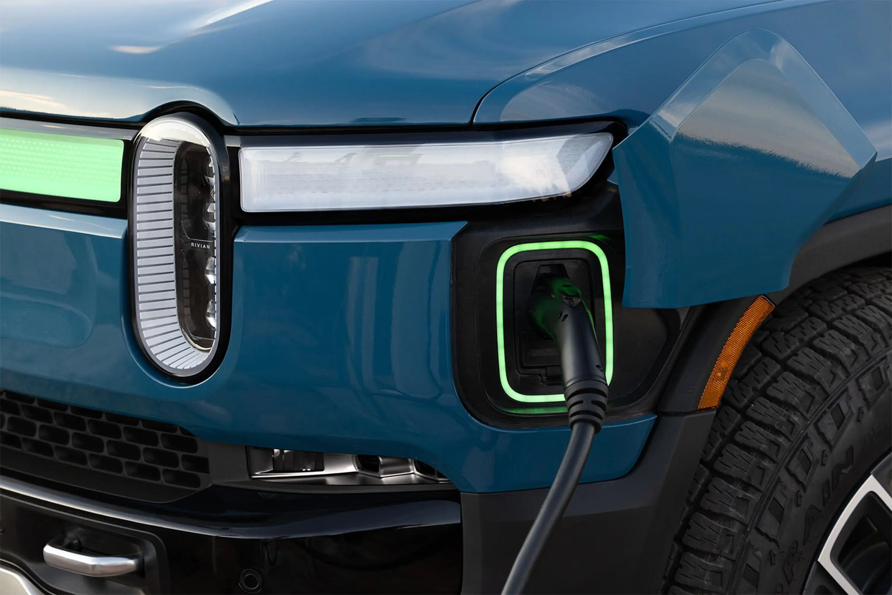 2023 Rivian R1S EV SUV review charging port plugged in