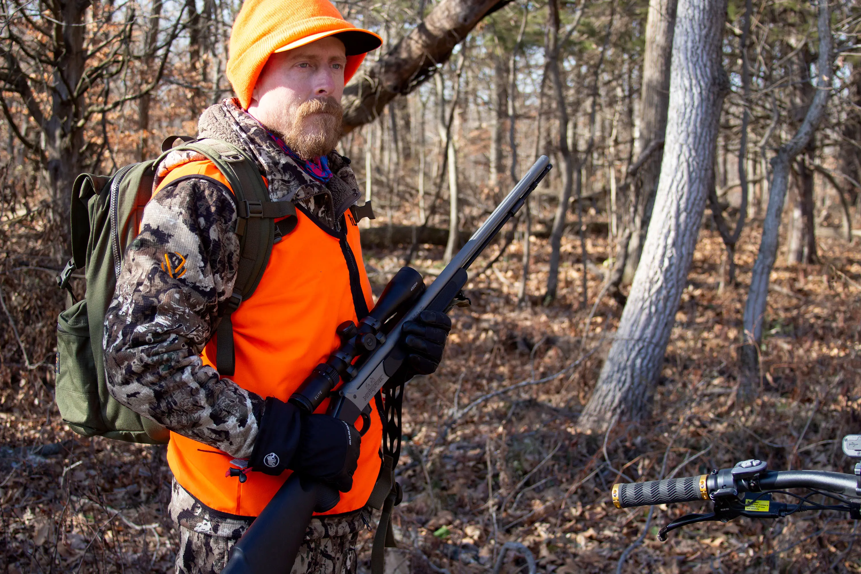 Hunter in blaze orange with a muzzleloader