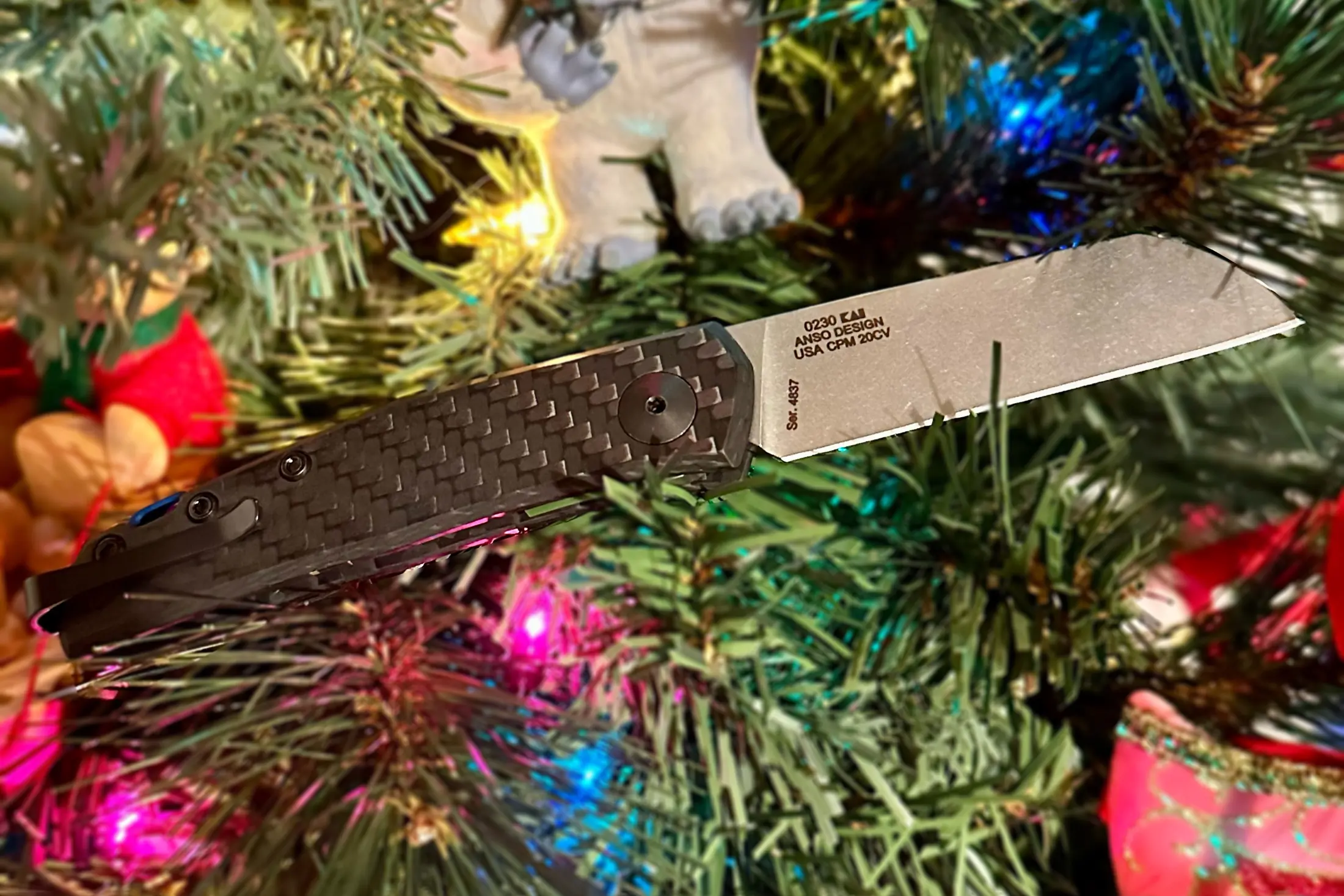 zero tolerance 0230 folding knife open with Christmas tree, lights, and ornaments