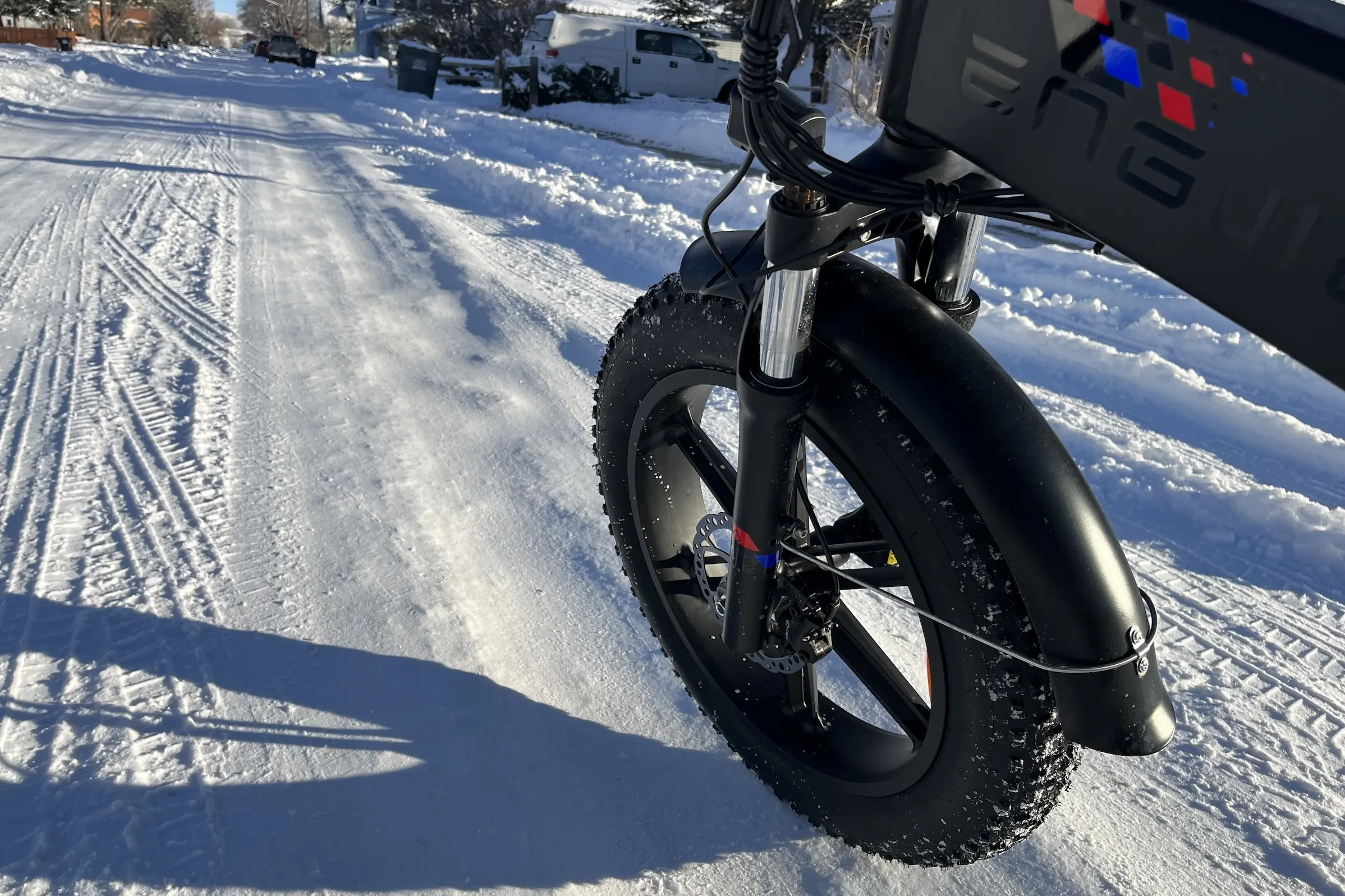 engwe 3 review close-up of front wheel on snowy road.