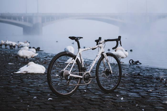 The custom Kafka Festka bike near the water on a foggy day