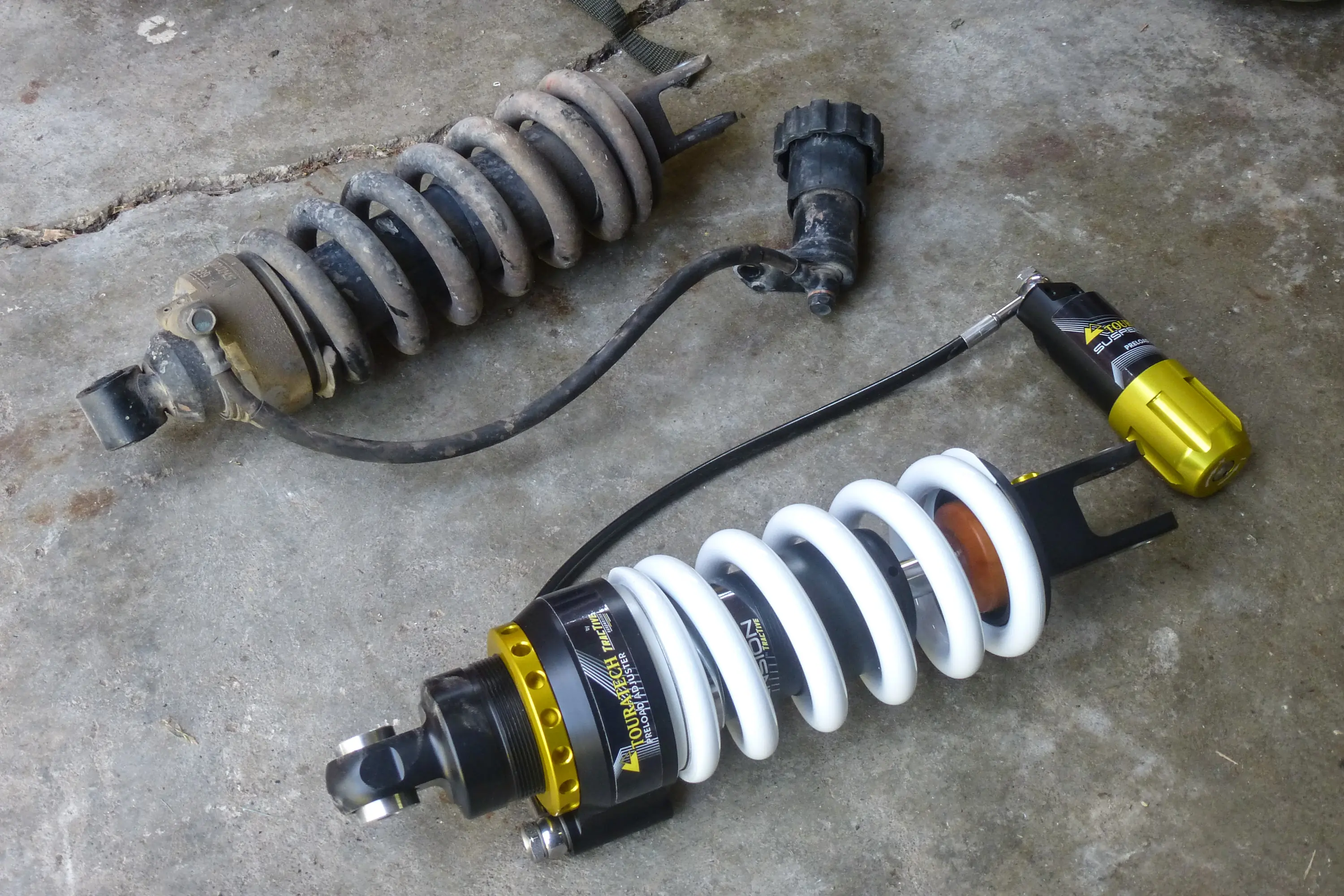 Tuning Motorcycle Suspension swapping old for new Tuning Motorcycle Suspension old and new spring and shock side-by-side