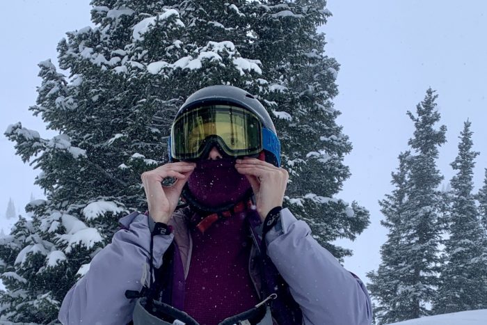 Editor Mary Murphy pulling up a balaclava over her face on a powder day