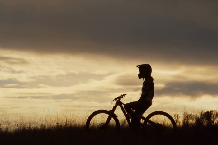a woman on a mountain bike