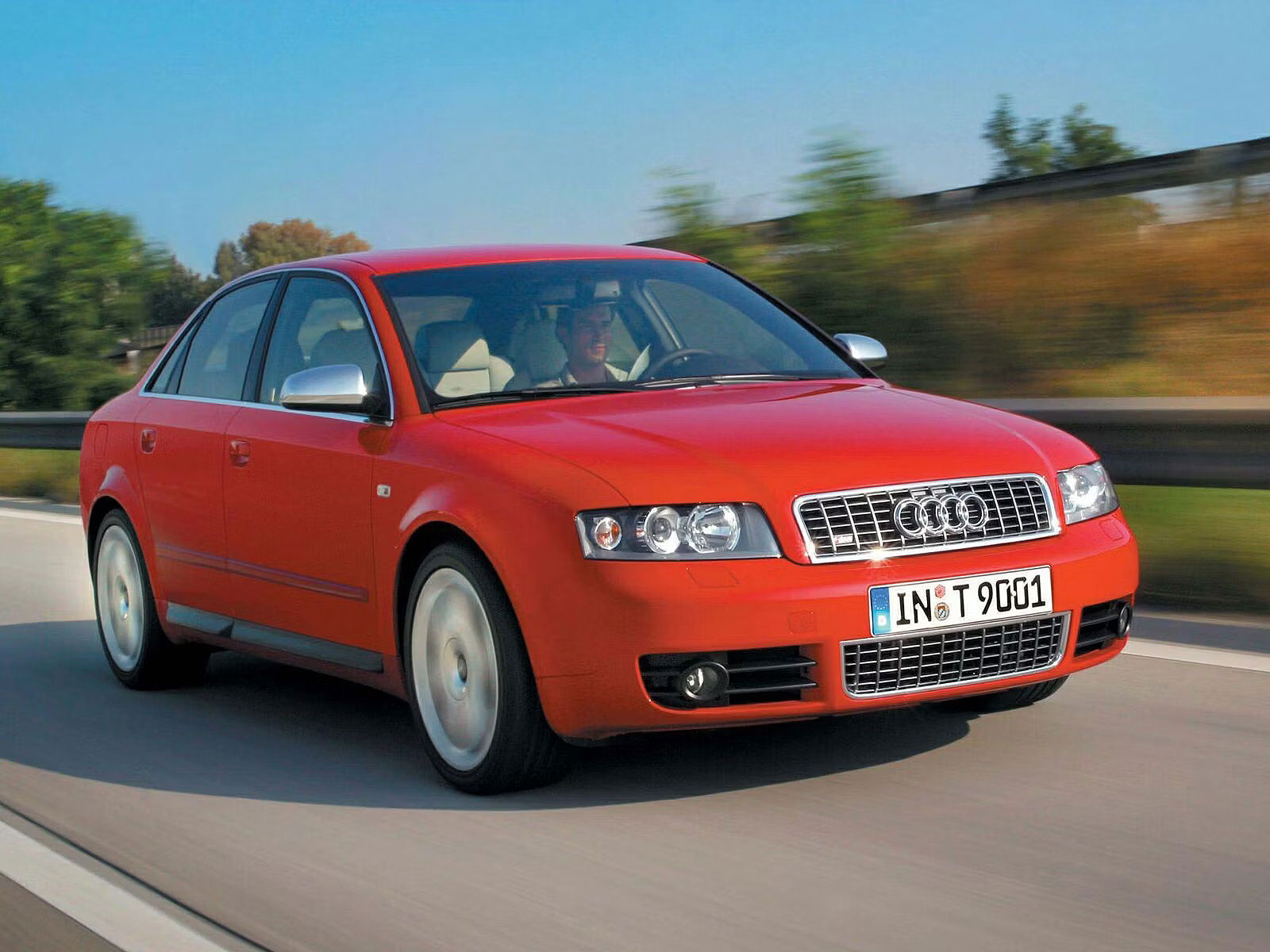 red 2003 Audi S4 driving