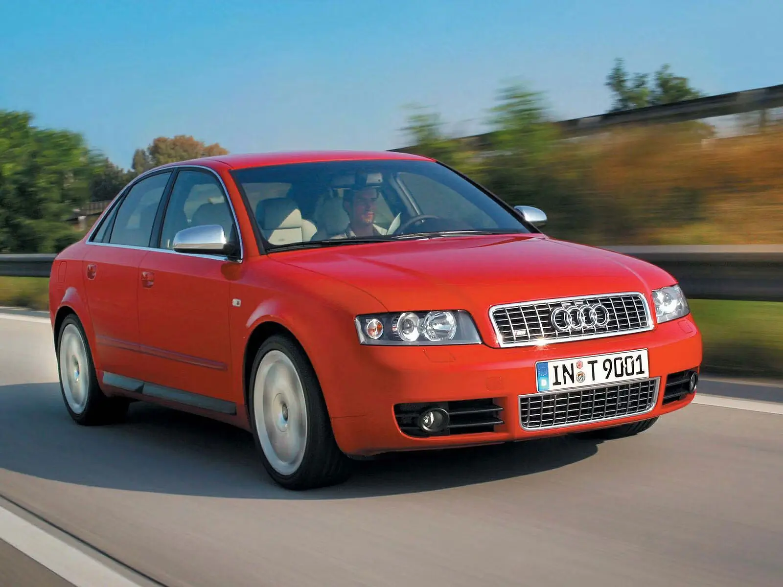 red 2003 Audi S4 driving