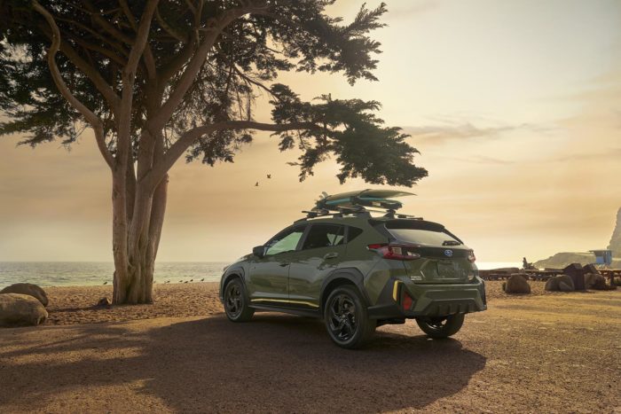 2024 Subaru Crosstrek at the beach with surfboards