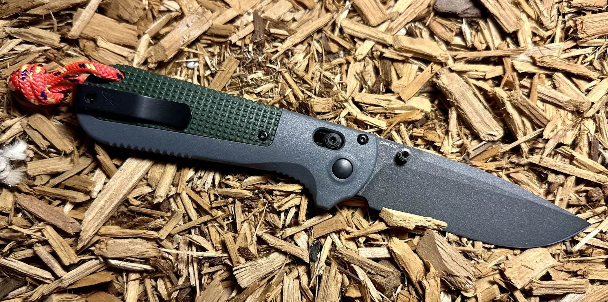 Benchmade Redoubt Knife open on wood shavings