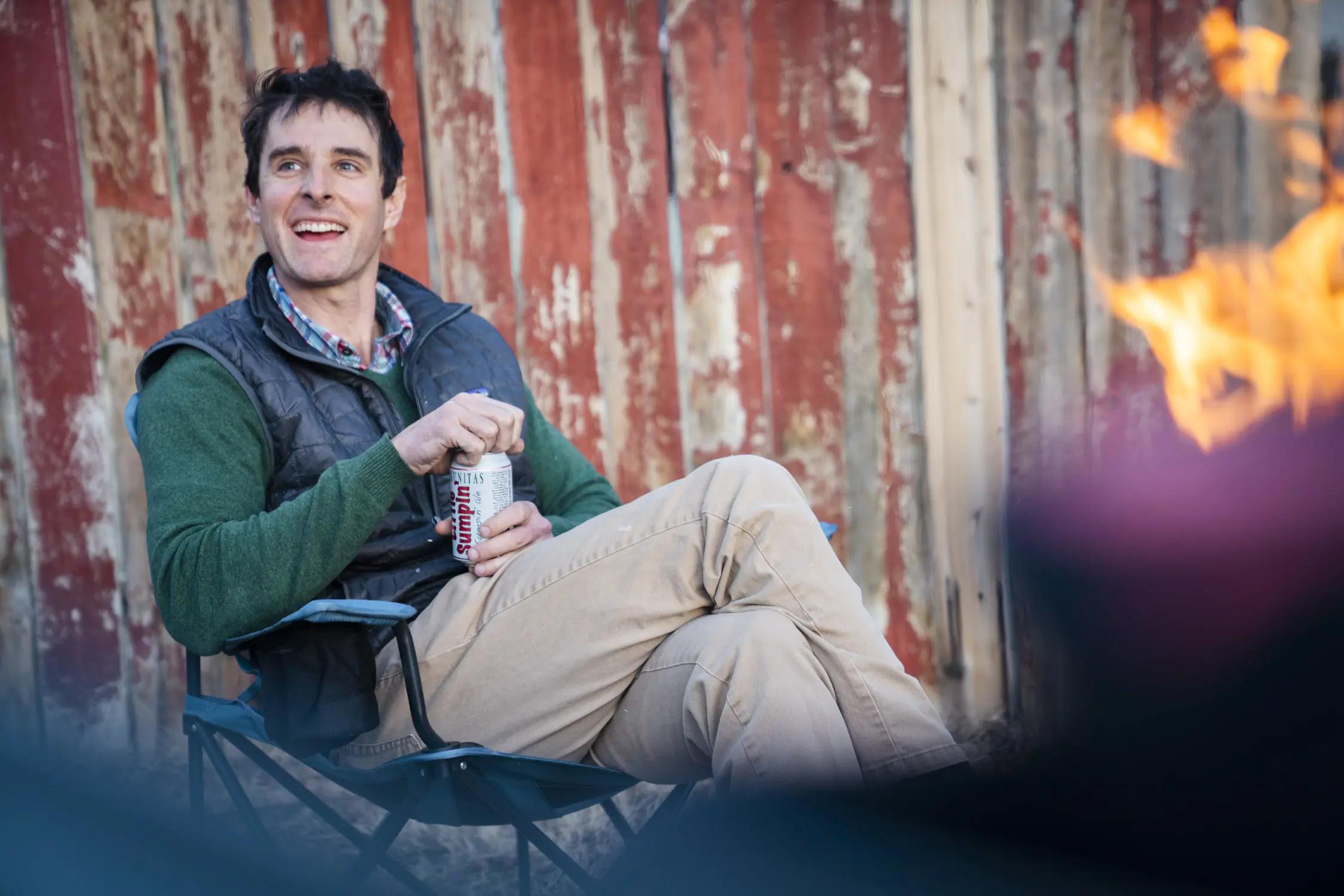 Man Sitting in REI Co-op Skyward Chair Around the Campfire