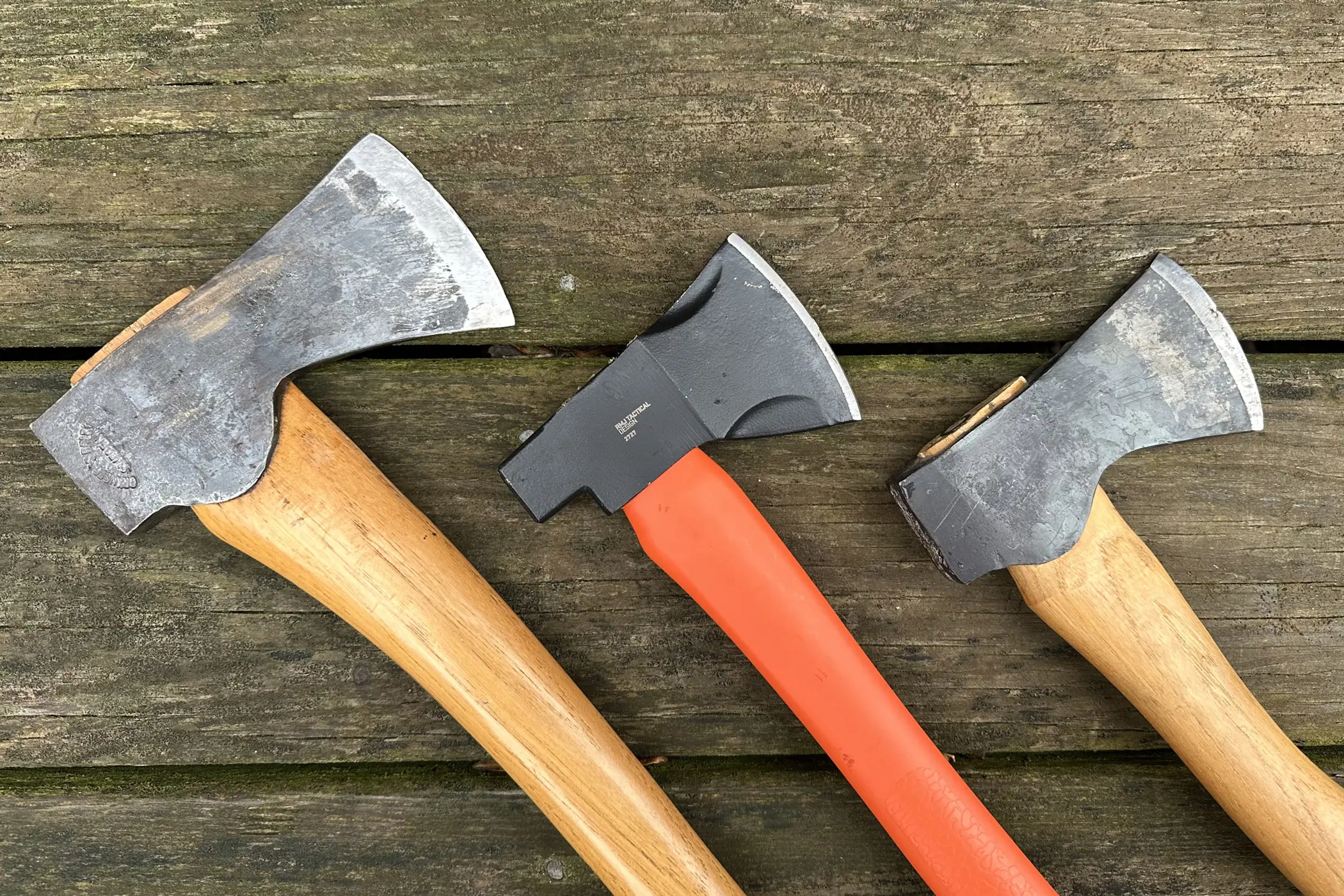 Three hachets on a table