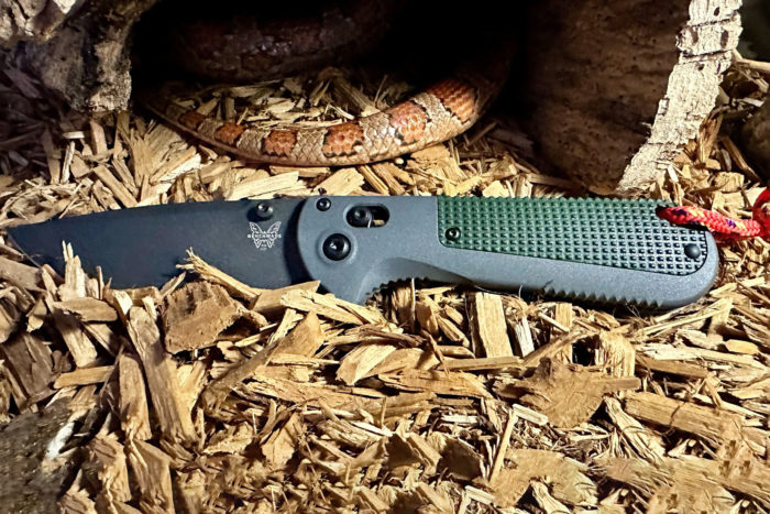 Benchmade Redoubt knife next to a snake
