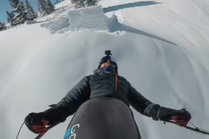 trevor kennison mid-air as he completes a full double backlip on a sit-ski