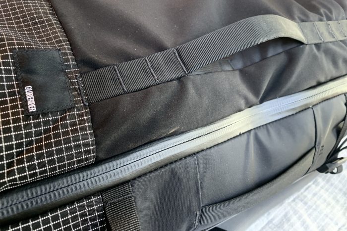 side grab handles and sealed zippers on the Matador Globerider travel pack