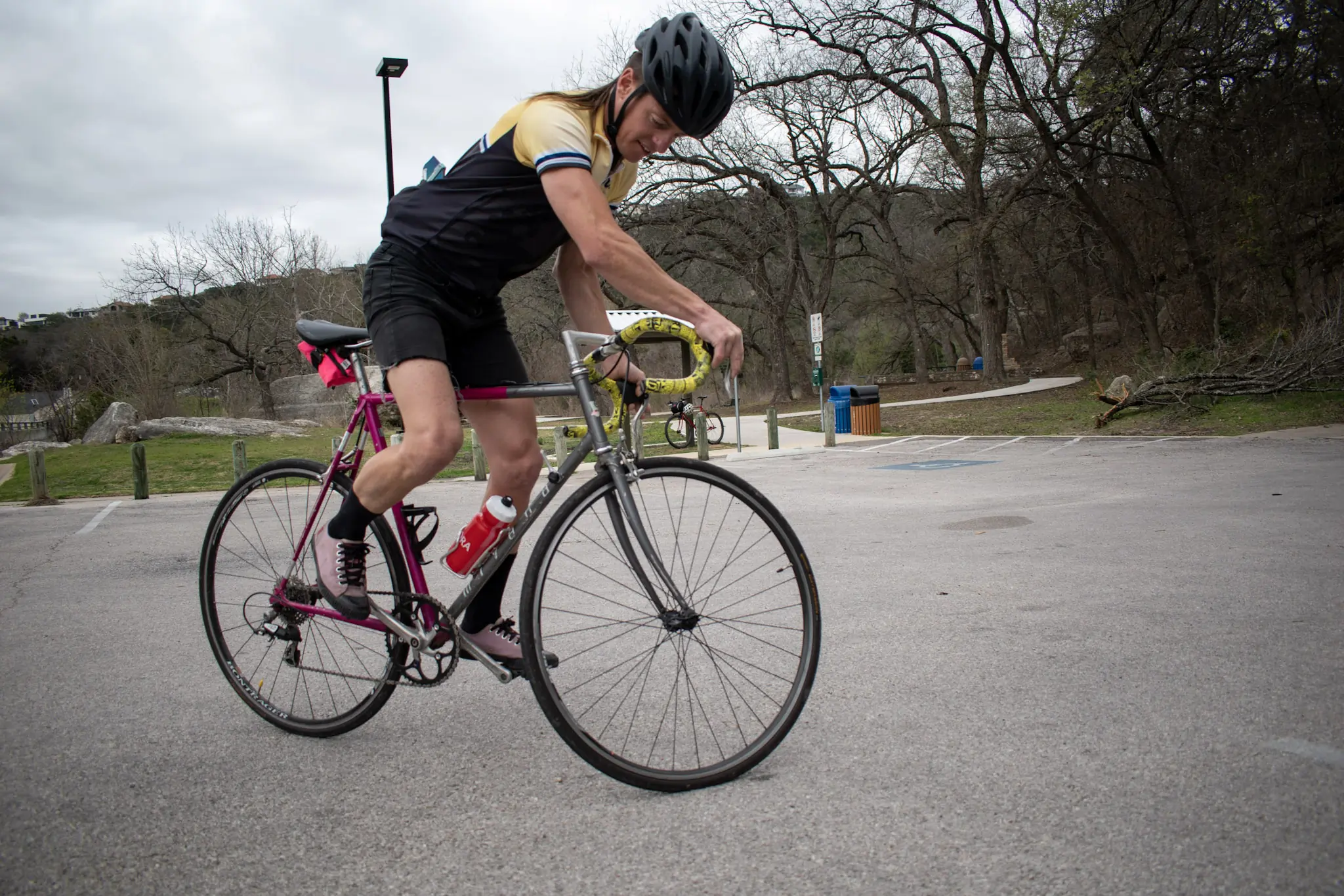 the author on a track stand on his budget road bike