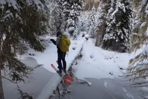 crossing a log on skis
